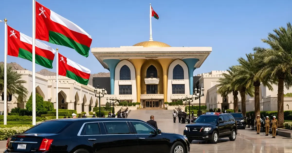 Exterior view of the Al Alam Palace in Muscat, Oman, serving as the venue for indirect US-Iran nuclear talks, featuring diplomatic vehicles and Omani flags under a clear sky.