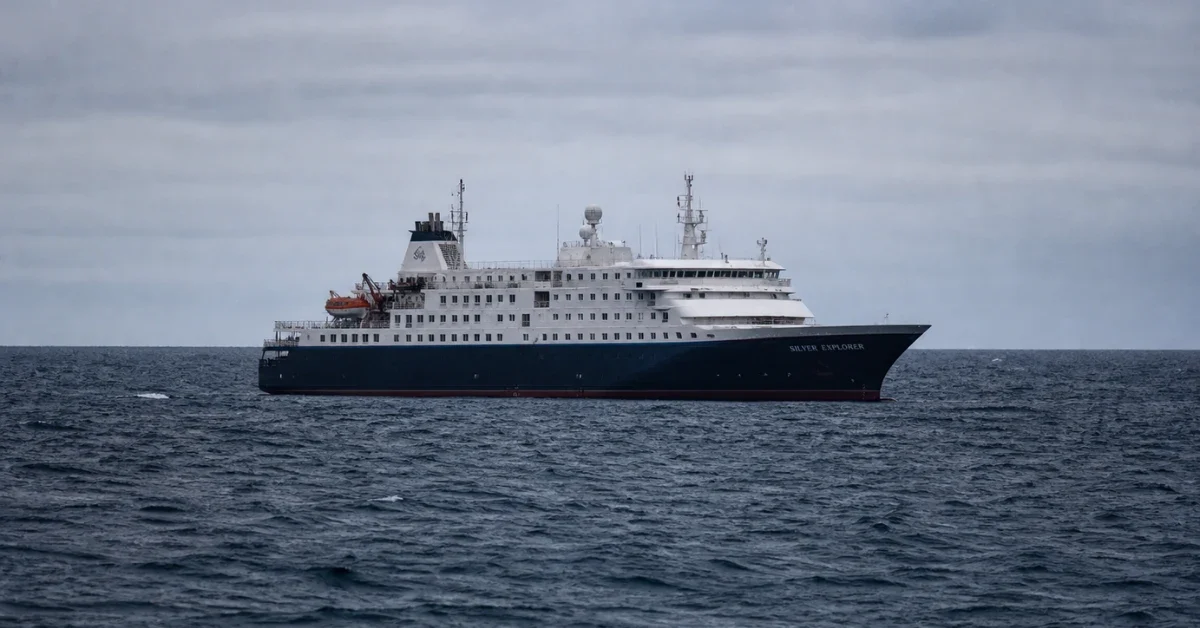 The MV Hondius expedition cruise ship anchored in the Atlantic Ocean under overcast skies.